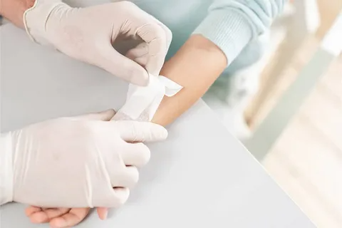 Doctor providing emergency wound care treatment at ER in League City